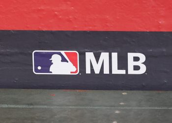PHOENIX, AZ - APRIL 24:  The MLB logo on the dugout wall before the MLB baseball game between the Tampa Rays and the Arizona Diamondbacks on April 24, 2025 at Chase Field in Phoenix, Arizona. (Photo by Kevin Abele/Icon Sportswire)